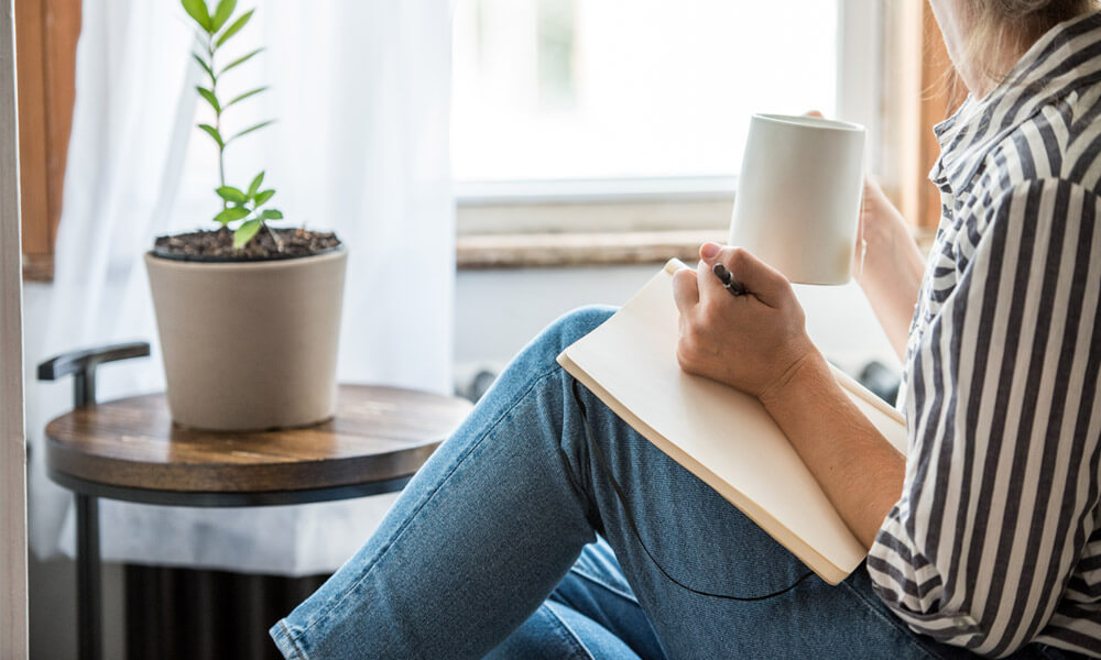 woman writing in journal